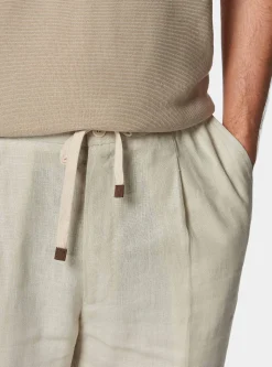 Pantaloni in puro lino con pince e coulisse